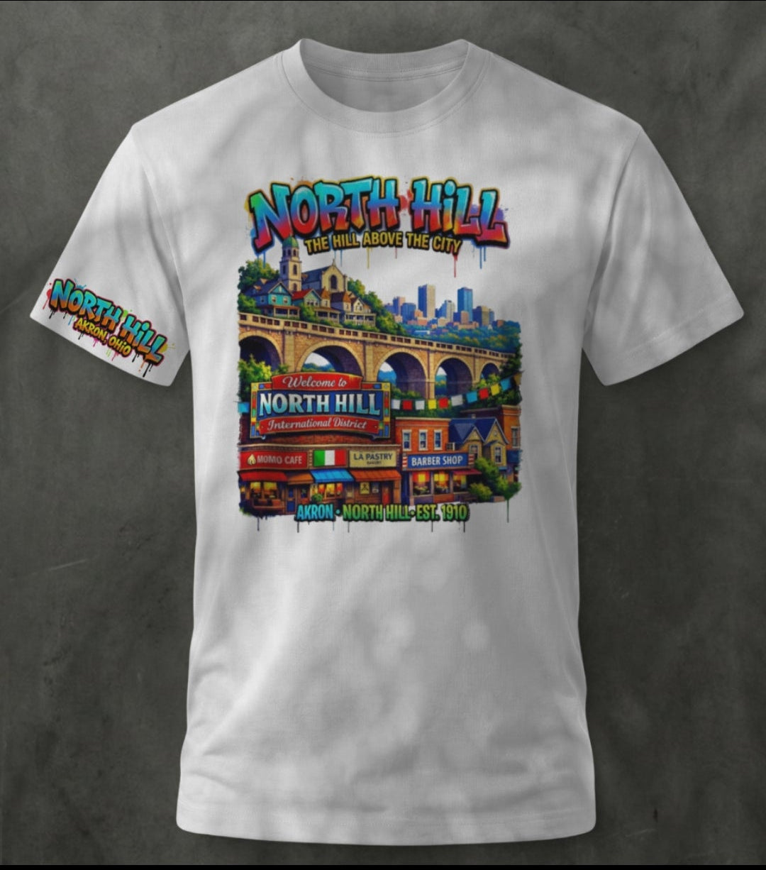 White t-shirt with colorful graphic design on a dark background