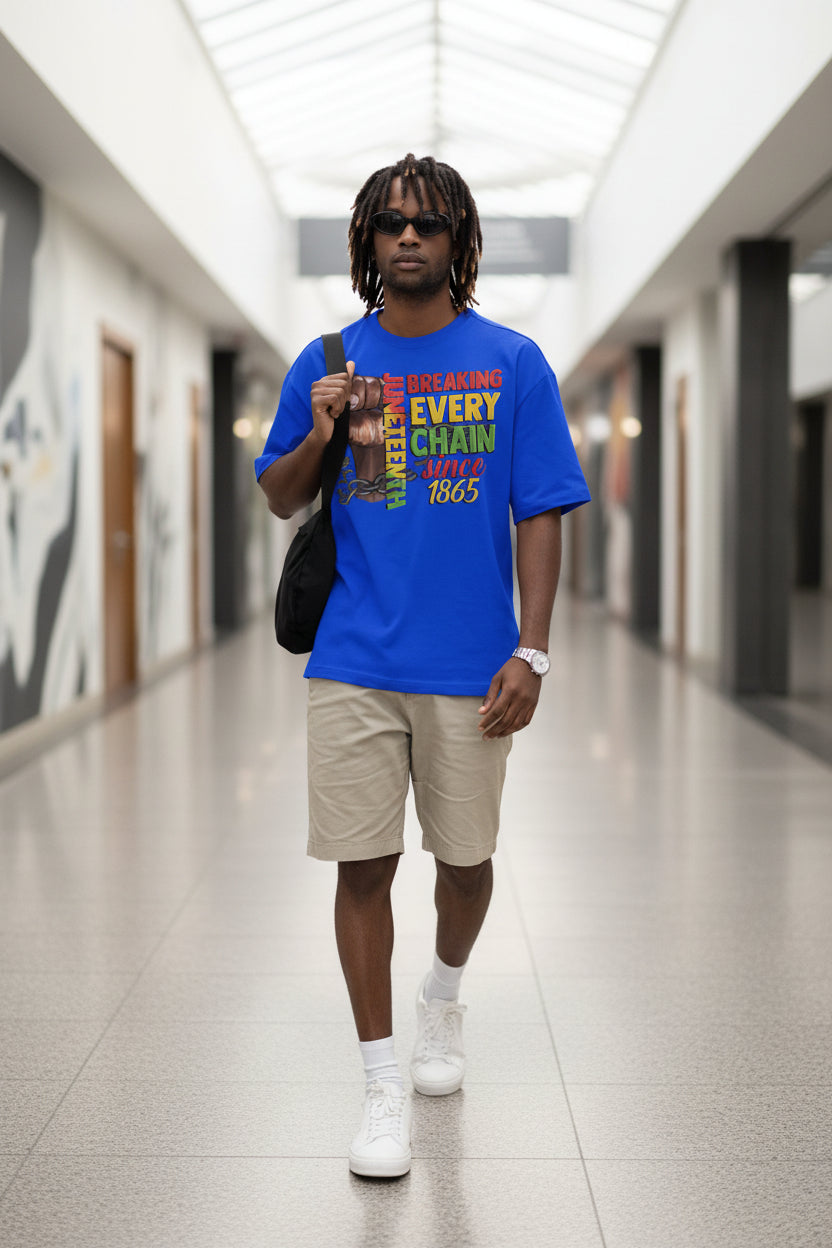 Man wearing a blue t-shirt with a message of freedom and equality, holding a bag.